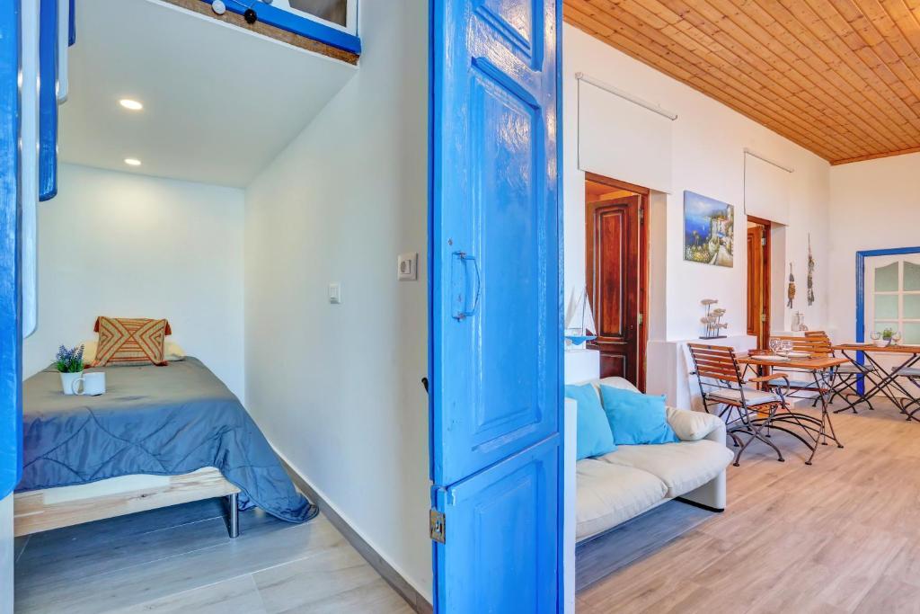 La Casa del Capitán - loft-bedroom-blue-door-living-room